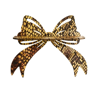 Golden bow wood wall shelf with snake pattern texture and earring organizer slots