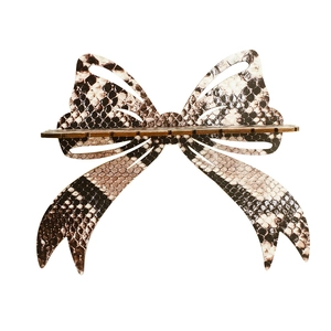 Minimalist wooden bow-shaped wall shelf with brown snake pattern for home storage