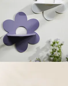 Detail view of flower shaped wooden wall shelves in purple and white minimalist design