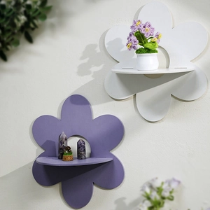 Bohemian flower-shaped wooden wall shelves in purple and white for crystal display