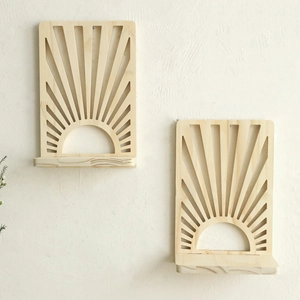 Detail of wooden fan-shaped floating wall shelf with sunburst hollow design