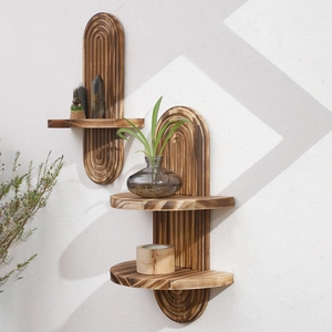 Detailed view of arched carbonized solid wood wall shelves with concentric circle engraving