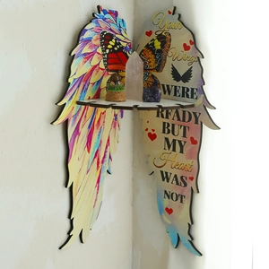 Corner butterfly wing shelf showing colorful patterns and small crystal ornaments
