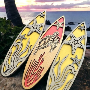 Detailed laser-cut surfboard wall decor with sea turtle and starfish wooden patterns
