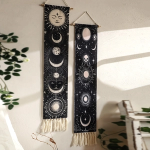 Bohemian wall tapestry with sun and moon pattern, celestial black fabric with fringe