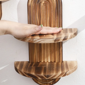 Detail view of double-layer solid wood wall shelf with arched vertical grille design