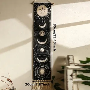 Detail of bohemian sun and moon tapestry featuring cotton linen texture and cream fringe