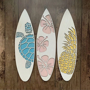 Three-piece wooden surfboard wall decor set with turtle, flower, and pineapple laser cutouts