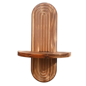 Capsule shaped dark wood wall shelf with concentric grooves and semi-circular tray
