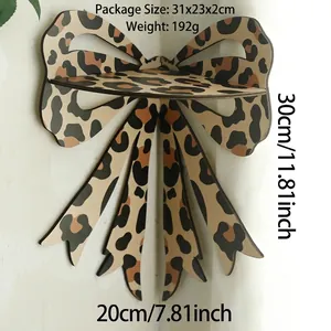 Detail view of bow-shaped wooden corner shelf with brown leopard print and 30cm height