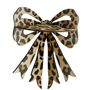 Bohemian bow-shaped wooden wall shelf featuring a stylish leopard print pattern design