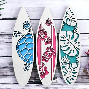 Three-piece surfboard shaped wooden wall decor with laser-cut tropical turtle and leaf designs