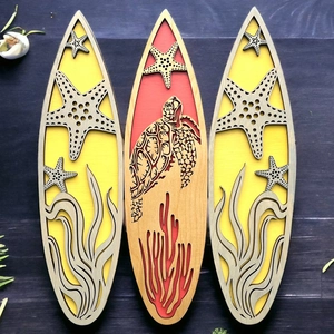 Three-piece ocean theme surfboard wooden wall art with starfish and turtle carvings