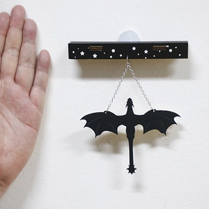 Creative black dragon silhouette wall hanging decor with white star base and silver chains