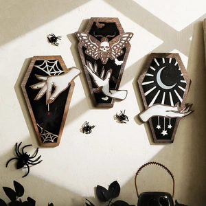 Gothic coffin-shaped wall decor set with spider and moon motifs on a beige wall