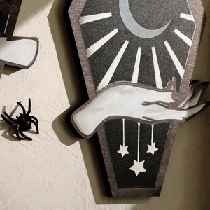 Gothic coffin-shaped wooden wall hanging with mystical moon and stars illustration