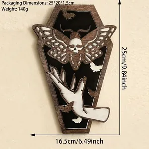 Detailed view of Gothic wood coffin wall decor featuring moth and moon hand engraving