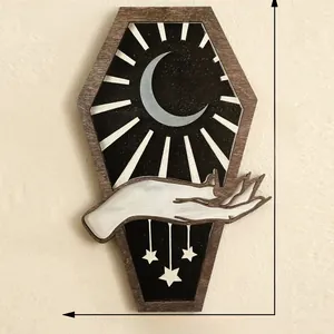 Close-up of gothic coffin wood wall decor with crescent moon and stars design