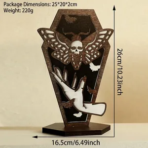 Detailed view of coffin-shaped wooden Gothic shelf with moth and hand carvings