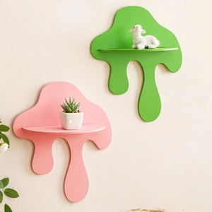 Detail of melting wave wall shelves in pink and green holding cute animal figurines