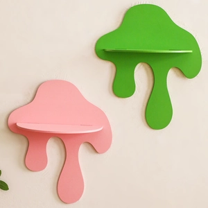Artistic melting droplet wooden wall shelf in matte pink and green for home decor