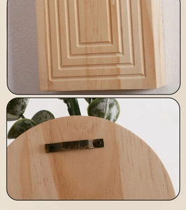 Detail van houten wanddecoratie met natuurlijke nerf en stevige metalen zaagtandhanger