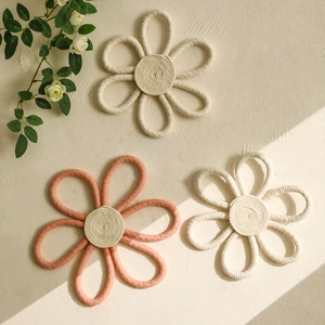 Handwoven cotton rope flower coasters and wall decor in bohemian pink and white style