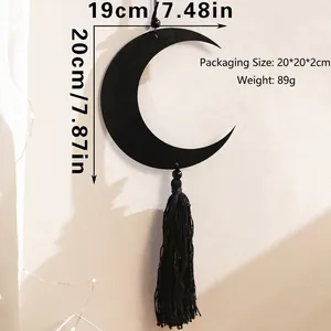 Detail view of black moon wood hanging decor with tassel showing 19cm by 20cm dimensions