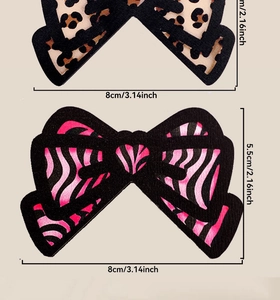 Detailansicht von Schleifen mit Leoparden- und Zebramuster, Maße ca. 8 cm mal 5,5 cm