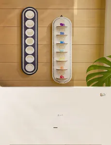 Detail of wooden bohemian wall shelves with moon phases and crystal storage trays