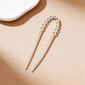 Minimalist silver U-shaped metal hair pin with elegant twisted texture design for women