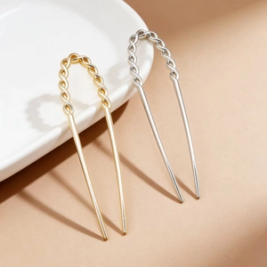 Minimalist U-shaped hair pins in gold and silver finish with elegant twisted top design