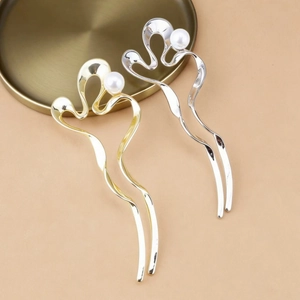 Minimalist U-shaped hair pins in gold and silver finish with elegant white pearl accents