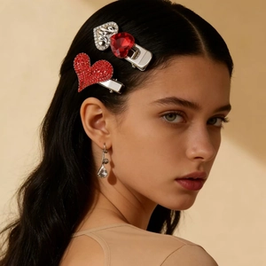 Sparkling silver rhinestone heart hair clips and matching earrings set on a model