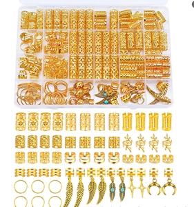 Detailed close-up of 250pcs gold hair rings and hollow cuffs with various charms