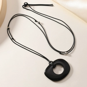 Minimalist black obsidian circle pendant on wax cord necklace with silver beads