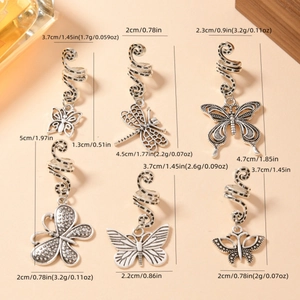 6pcs vintage silver spiral hair clips with dragonfly and butterfly charms on beige background