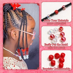 Gros plan sur de grosses perles en acrylique rouges et blanches pour tresses africaines