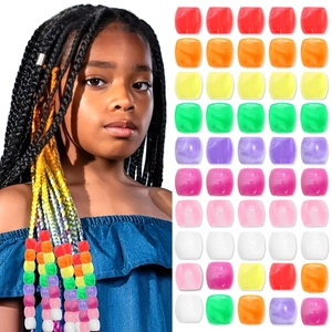 Colorful acrylic hair beads for dreadlocks showing mixed marble texture on white background