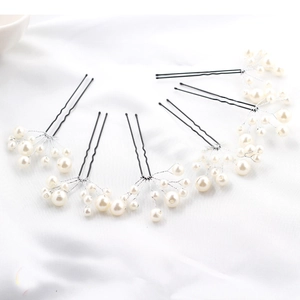 Detail of 6-piece U-shaped hair pins with white faux pearls and silver metal wire design