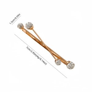 Elegant gold cross hair clip with sparkling rhinestones for a minimalist women's hair accessory