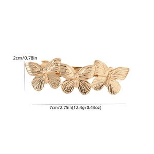 Elegant gold metal butterfly hair clip with a brushed texture and 3D relief details