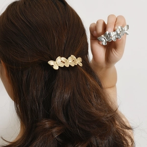 Elegant gold and silver butterfly hair clips with brushed metal finish for women