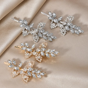 Set of four rhinestone leaf hair clips in gold and silver finish for bridal styling