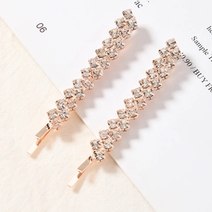 Pair of rose gold hair clips with rows of sparkling pavé rhinestones in a minimalist design