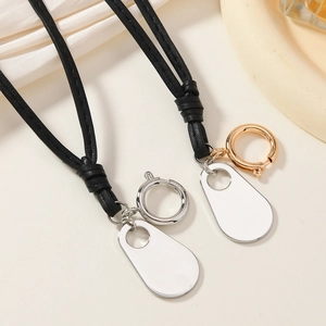 Minimalist long black cord necklace with polished gold and silver metal pendants