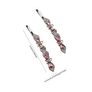 Detailed view of vintage silver hair clips with purple stones and size measurements