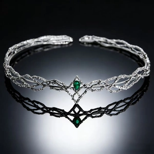 Silver elven crown tiara with intricate branch design and green teardrop gemstone