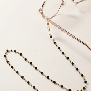 Elegant beaded glasses chain with black beads, star pendant and gold lobster clasps