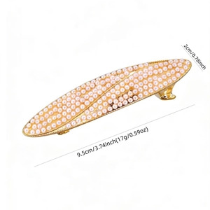 Detail view of 9.5cm gold hair clip with pink pearls and size dimensions on white background